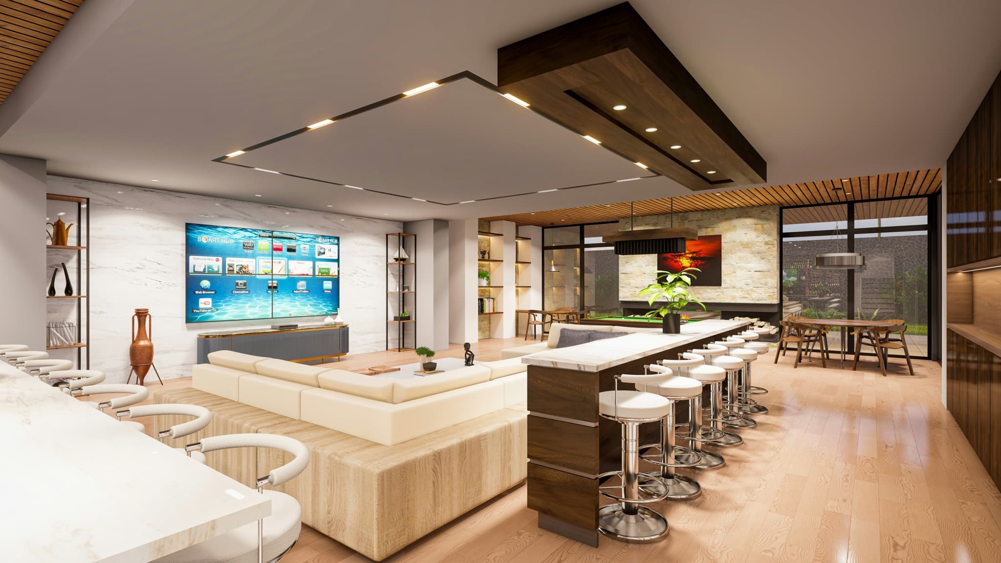 Open-plan media room with a large screen, sectional seating, and a bar